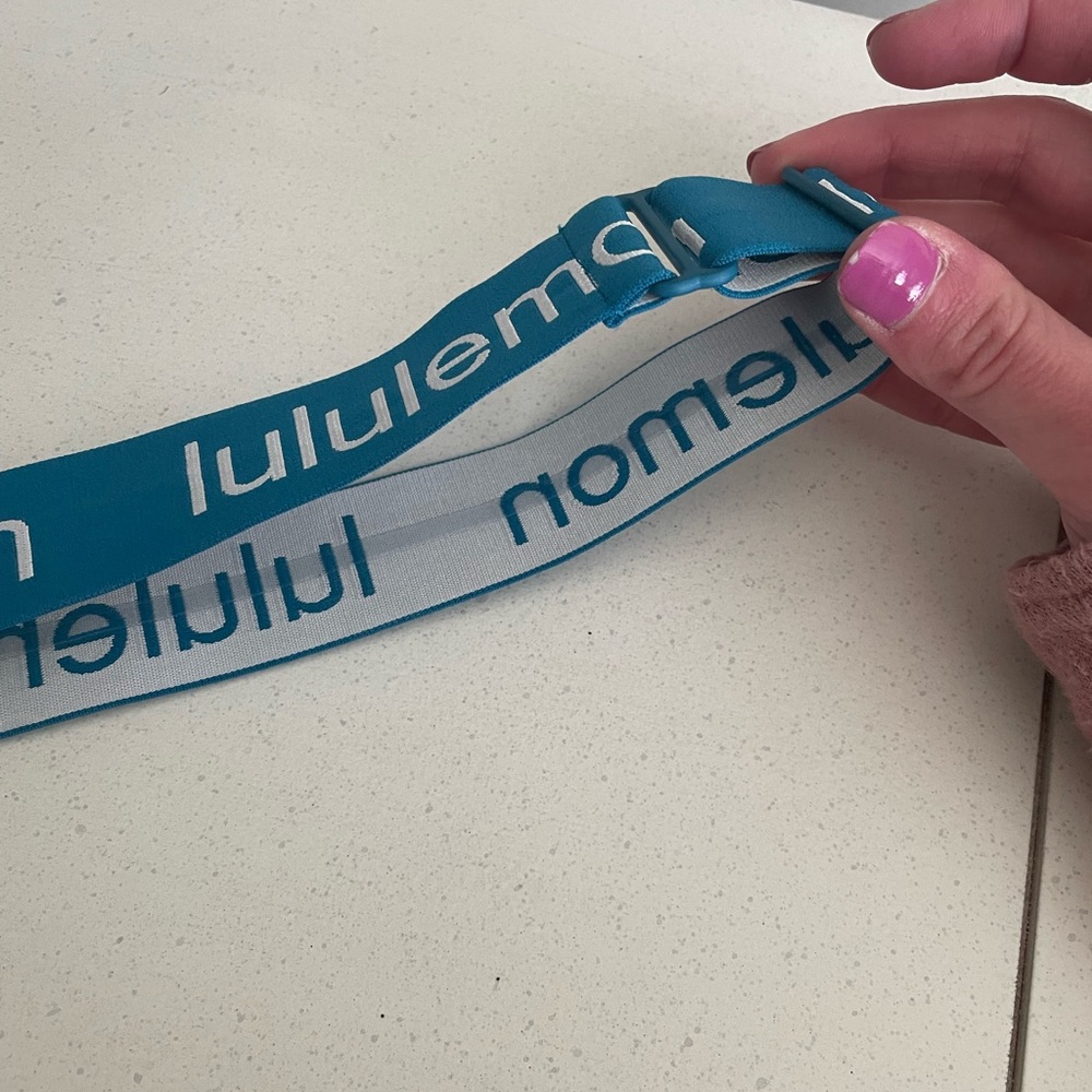 Blue LULULEMON headband. Adjustable with clear non-slip liner.